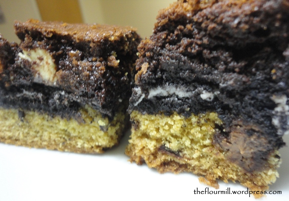 Cookie-oreo-brownie layer cut into squares